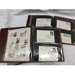 Two Stanley Gibbons brown ring bound albums containing sleeve mounted FDCs including numerous