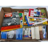 A box containing a collection of Association Football Club programmes and other publications