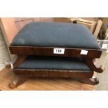 A pair of 19th Century mahogany footstools with upholstered tops, set on swept scroll feet - sold