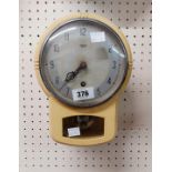 A vintage Smiths Enfield painted metal cased drop dial wall timepiece with visible pendulum
