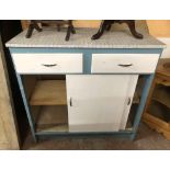 A 92cm mid 20th Century kitchen cabinet with Formica top, two frieze drawers and sliding cupboard