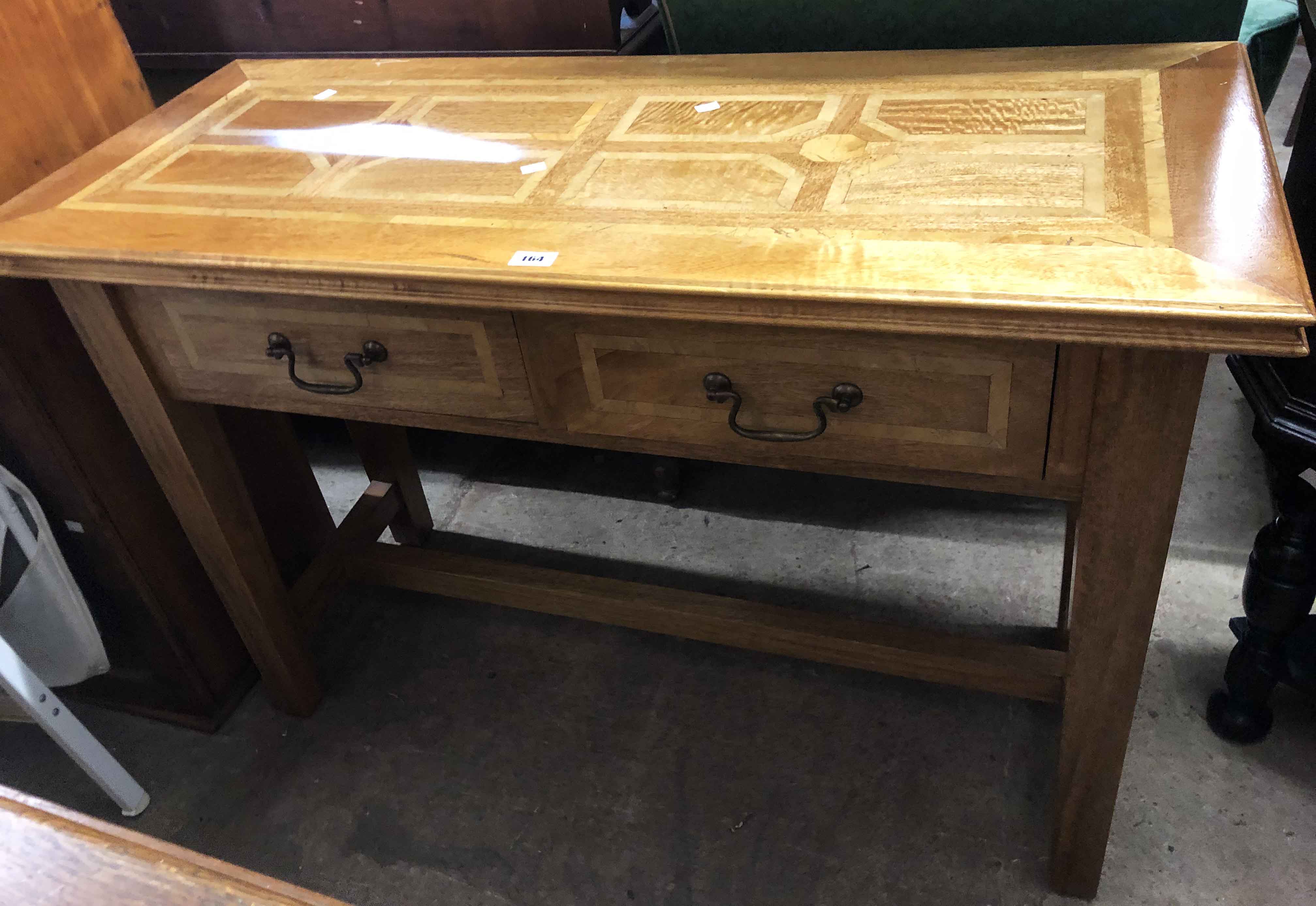 A 1.21m modern oak side table with travertine limestone inlay and two frieze drawers, set on