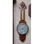 A 20th Century polished oak framed banjo barometer/thermometer with aneroid works