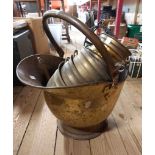 A brass coal scuttle - sold with a small selection of plant pots, wine rack, etc.