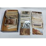 A shoe box containing a large collection of early 20th Century and other postcards including