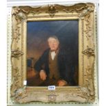 An ornate gilt gesso framed oil on canvas portrait of a seated gentleman - 37cm X 29cm