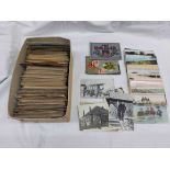 A box containing a collection of early 20th Century and other postcards including topographic,