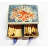 A vintage double matchbox holder with Scandinavian ceramic tile to top, moulded with a stylised