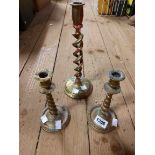 A pair of late 19th Century small cast brass candlesticks with bobbin turned style stem - sold