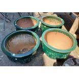 A set of four large green glazed garden planters