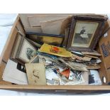 A box containing a collection of antique and later family photographs including posed figures,