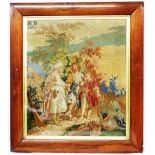 An antique tapestry panel depicting a scene of travellers in the Middle East with initials H.D.