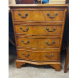 A 51cm reproduction mahogany and cross banded serpentine front chest of four long graduated drawers,