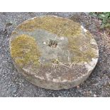 An old sandstone grinding wheel/mill stone