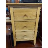 A 43cm modern Outlook solid oak bedside chest of three drawers, set on tapered legs