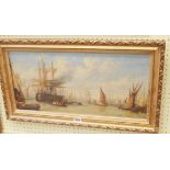 A gilt framed oil on canvas, depicting a busy harbour scene with numerous vessels at anchor and