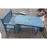 A slatted wood garden table with blue painted finish - sold with matching bench