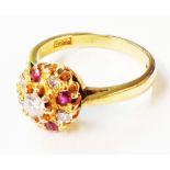 An 18ct. gold ring, set with five diamonds and four rubies - size J 1/2
