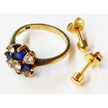 A 375 (9ct.) gold blue and white paste set ring - size P - sold with a pair of yellow metal stud