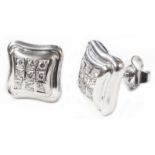 A pair of 750 (18ct.) white gold square panel earrings, each set with nine small diamonds in rows of