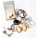 A stud case containing a 375 framed cameo brooch, a plated framed similar, banded agate brooch,