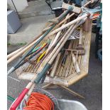 A large quantity of garden tools - sold with two electric hedge trimmers, wheelbarrow etc.