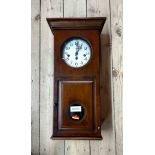 A boxed modern Hermle polished wood cased wall clock with eight day chiming movement