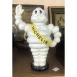 A modern painted cast iron Michelin Man moneybox