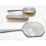 A silver and grey enamelled hand mirror and brush set - Birmingham 1929