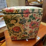 A 31cm vintage ottoman with original floral print upholstery and lift-top