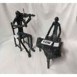 Two cast bronze figurines, each depicting a stylised musician decorated with an antiqued patina