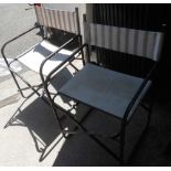 A pair of metal framed folding director's style chairs with slung canvas upholstery
