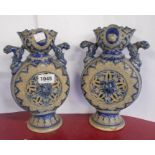 A pair of old Westerwald saltglaze stoneware vases of moon flask form with decorative gryphon