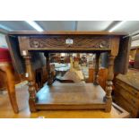 A 62cm vintage polished drop-leaf coffee table with antique style carved decoration and undertier,
