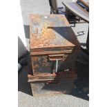 Two vintage tin transit trunks with black painted finish