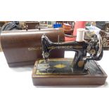 An old Singer sewing machine in original domed wooden case