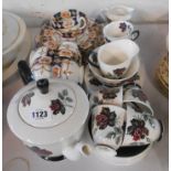 A Royal Albert bone china tea set decorated in the Masquerade pattern comprising teapot, milk and