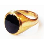 A 9ct. gold black onyx oval panel signet ring - size M