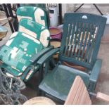 A pair of Aquarius green plastic garden chairs