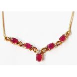 An import marked 375 (9ct.) gold pendant necklace, set with oval rubies interspersed with tiny