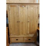 A 1.35m modern light oak triple wardrobe with hanging space and two drawers under