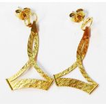 A pair of yellow metal flat-weave open drop earrings