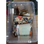 A crate containing a quantity of assorted collectable items including watercolours, frames, books,