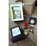 An antique small French ebonised wood cased carriage timepiece and a vintage travelling