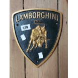 A modern painted cast iron Lamborghini sign