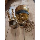 A selection of assorted brassware including helmet form coal scuttle, mortar, candlesticks, horse