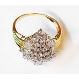 A 585 (14ct.) gold 1930's style diamond cluster ring with baguette and round cut stones - size P 1/2