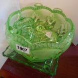 A large green uranium pressed glass bowl - sold with similar part dressing table set