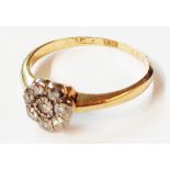 A marked 18 yellow metal ring, set with small diamond flowerhead cluster - size N