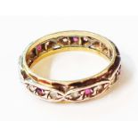 A marked SIL & 9ct red and white paste set eternity ring - size K